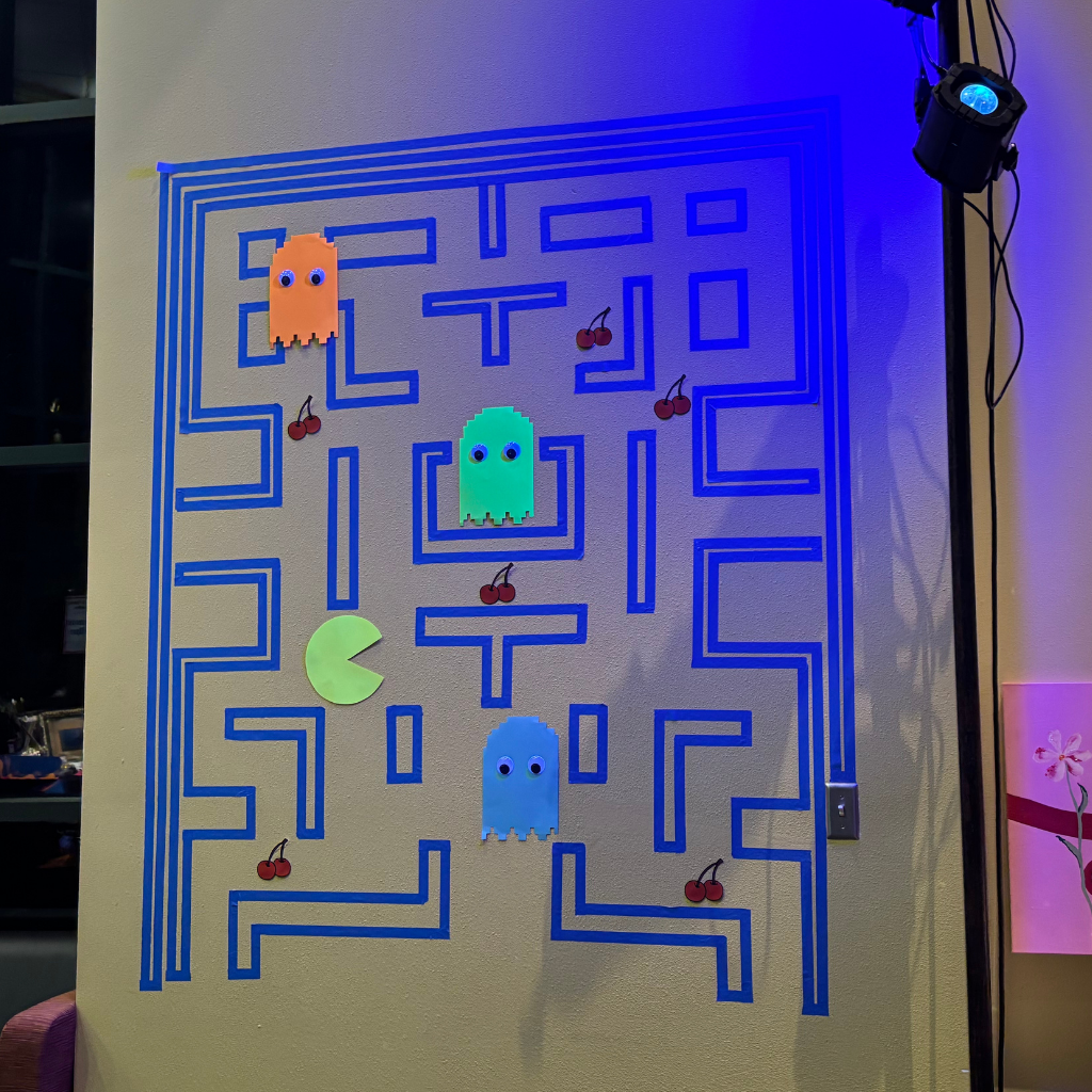 Wall that is decorated to look like a Pac Man game.